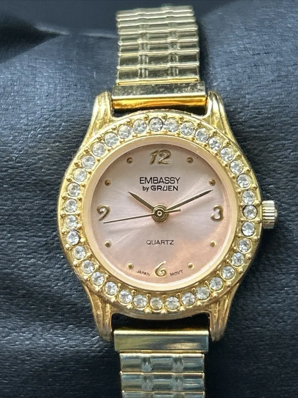 Embassy By Gruen Gold Tone Pink Dial Women’s Stretch Band Quartz Watch